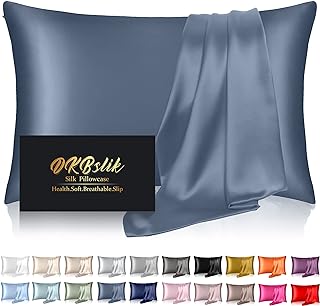 Alt text: "A luxurious, smooth silk pillowcase presented in a rich slate blue color, with a display box indicating it's a health-conscious, soft, breathable, and slip-resistant product. The image background showcases a variety of available colors, suggesting a wide selection to choose from